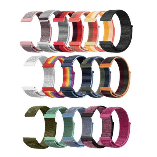 Sada barevných textilních řemínků na chytré hodinky v různých odstínech, včetně červené, oranžové, černé, duhové, zelené, modré a růžové varianty.